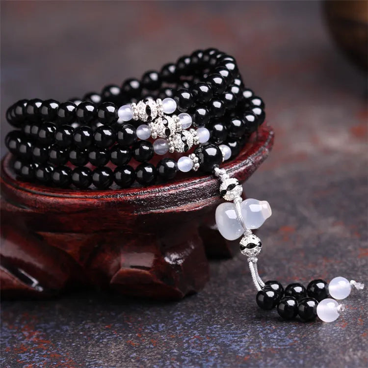 Natural black and red agate 108-bead bracelet with geometric shapes