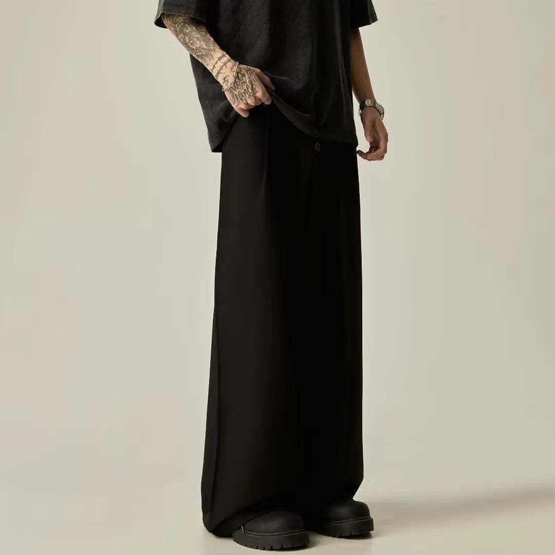 Men's solid colour casual trousers with wide-leg design and elasticated waist in cotton-polyester blend fabric