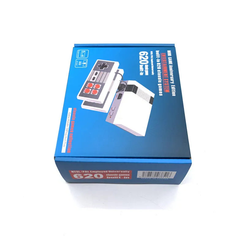 Compact black NES 8-bit retro game console with two classic controllers on a table.