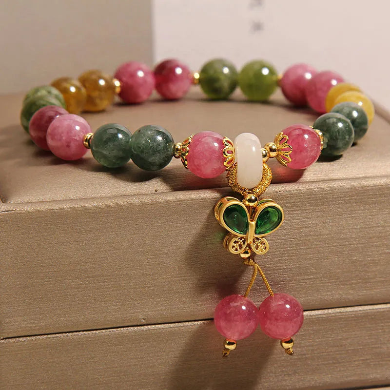 Women's tourmaline bracelet with colourful butterfly pendant and rhinestone detailing on adjustable chain