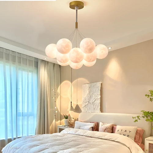 Nordic fish chandelier with moon bubble design in gold or black colours, showing iron body and PMMA lampshades