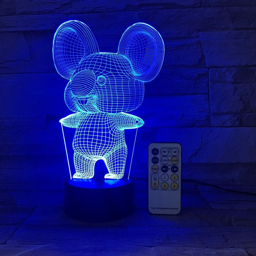 Koala-shaped night light with remote control showing seven colour options on a bedside table