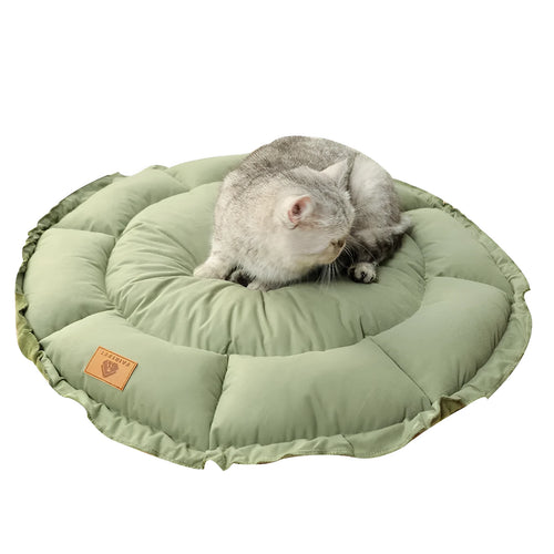 Grey donut-shaped cat bed with reversible cushion insert shown in medium size