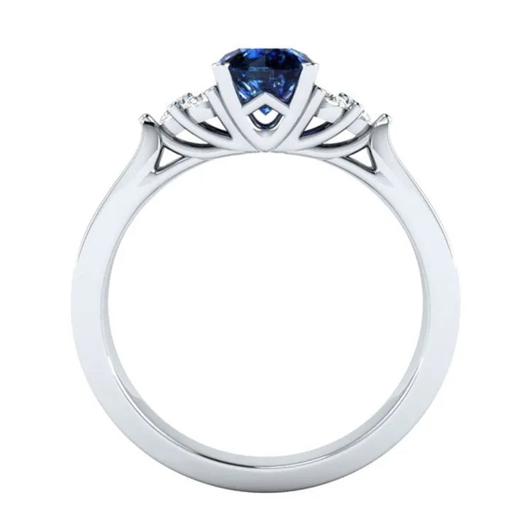 New inlaid sapphire zircon ring in 925 silver princess engagement ring on display