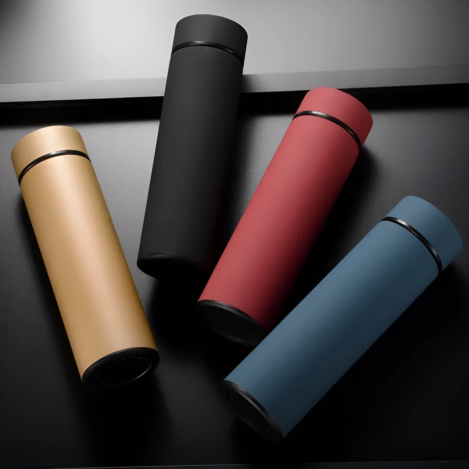 450ml stainless steel water bottle with double wall vacuum insulation in black, red, gold, and blue colour options