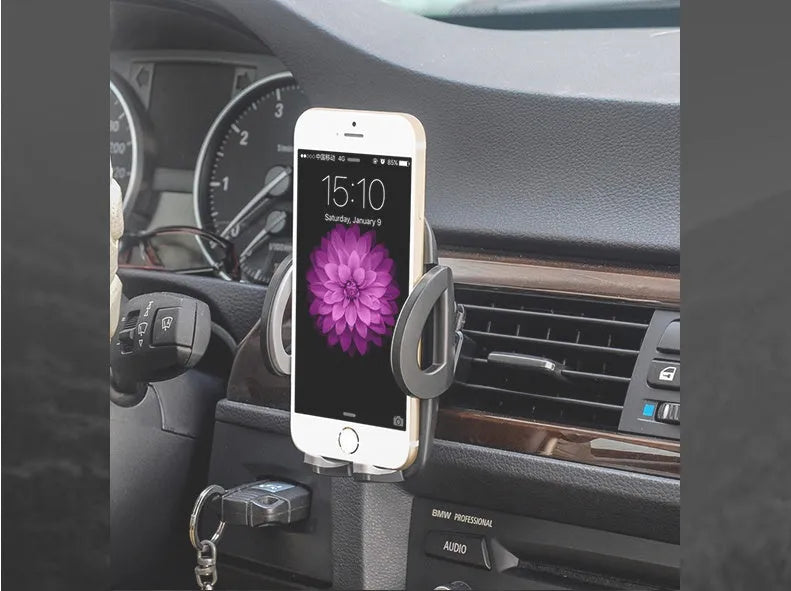 Black plastic car air conditioning outlet mobile phone holder mounted to car vent