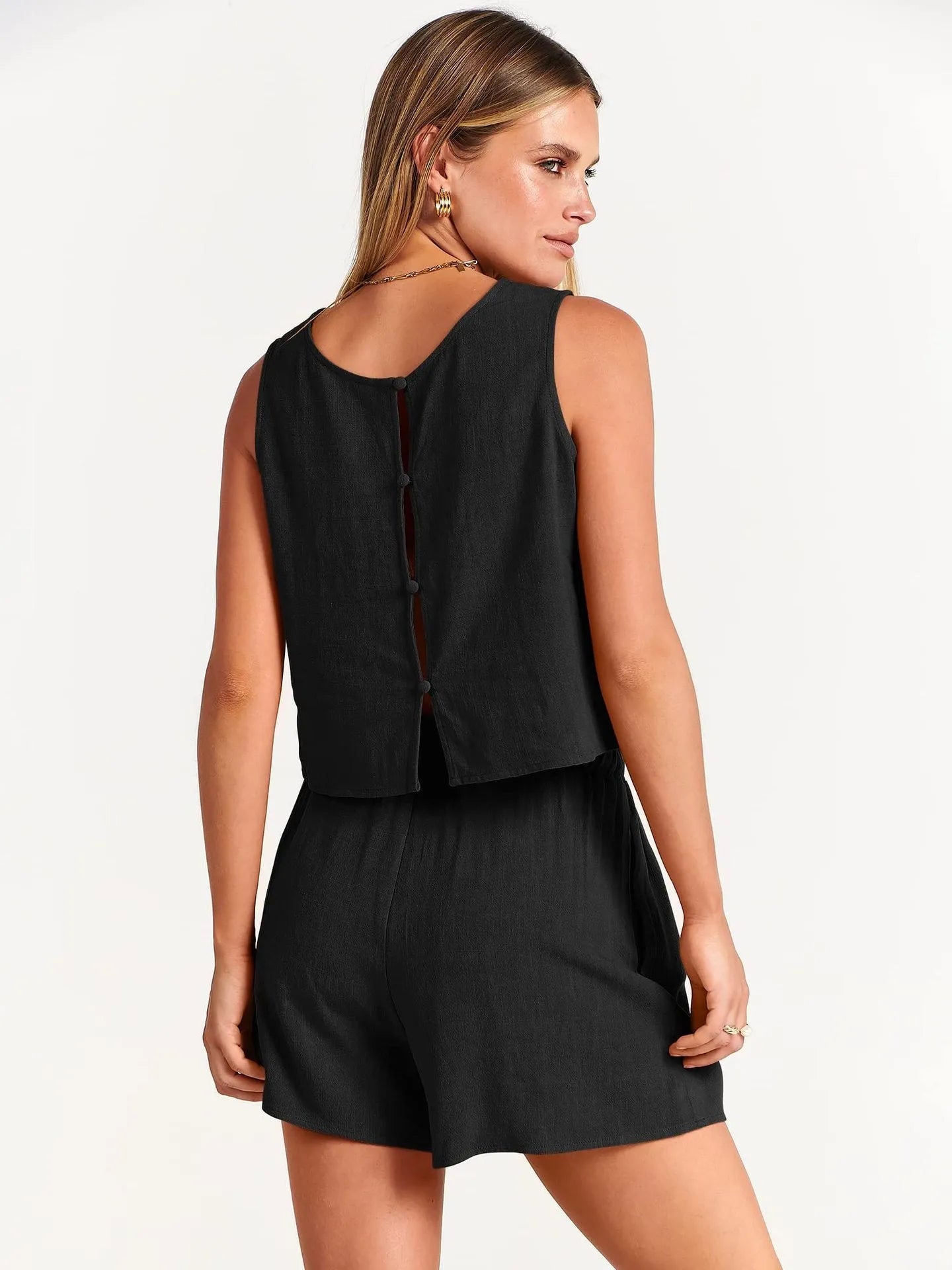 Women's apricot colour summer set with sleeveless top and drawstring shorts on a hanger.