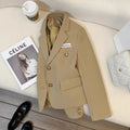 Women's black short suit coat with pockets and regular sleeves, loose fit design