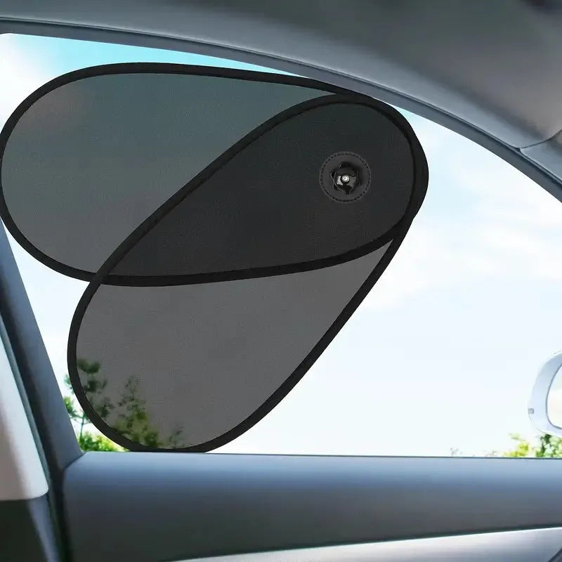 Black breathable mesh car side window sunshade stretched over glass with visible suction cups.