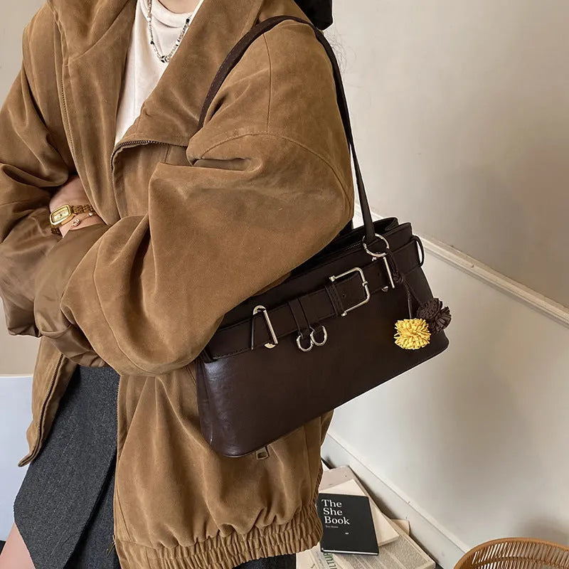Women's retro belt buckle shoulder bag in PU, horizontal square shape, black or brown, with splicing detail.