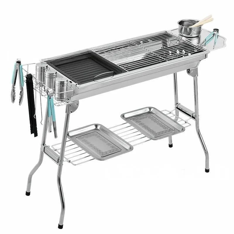 Stainless steel portable folding barbecue oven with grill, shown in a natural metal finish.