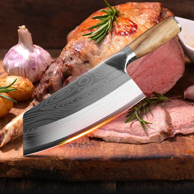 Stainless steel kitchen knife with a 320mm forged blade on a kitchen counter.