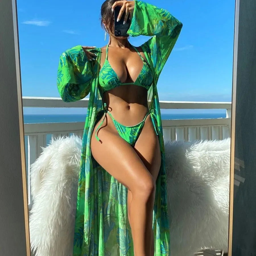 Women's blue banded bikini set with a long-sleeve floral cover-up blouse