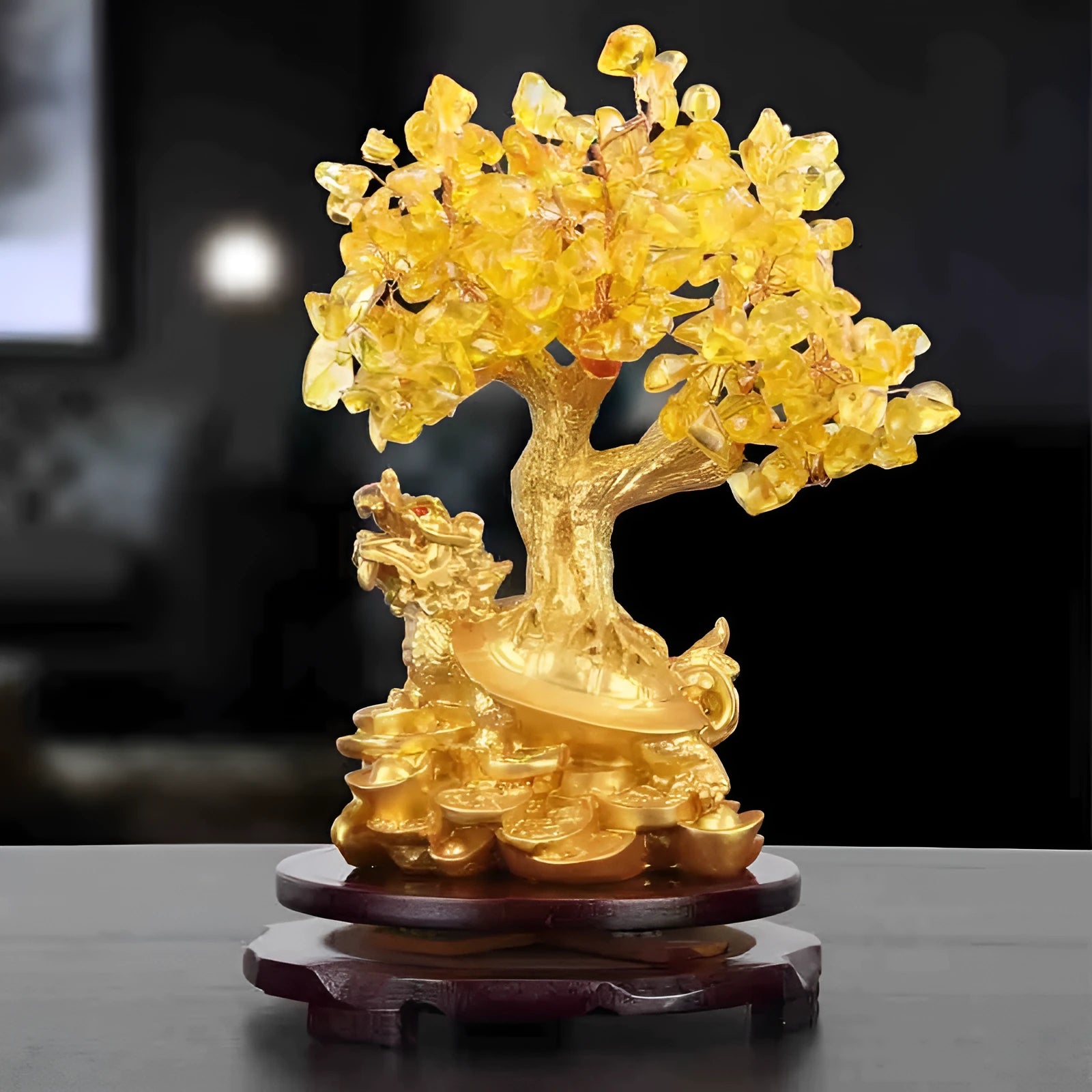 A citrine-coloured resin decorative ornament of a small water turtle and a money tree in Chinese style.
