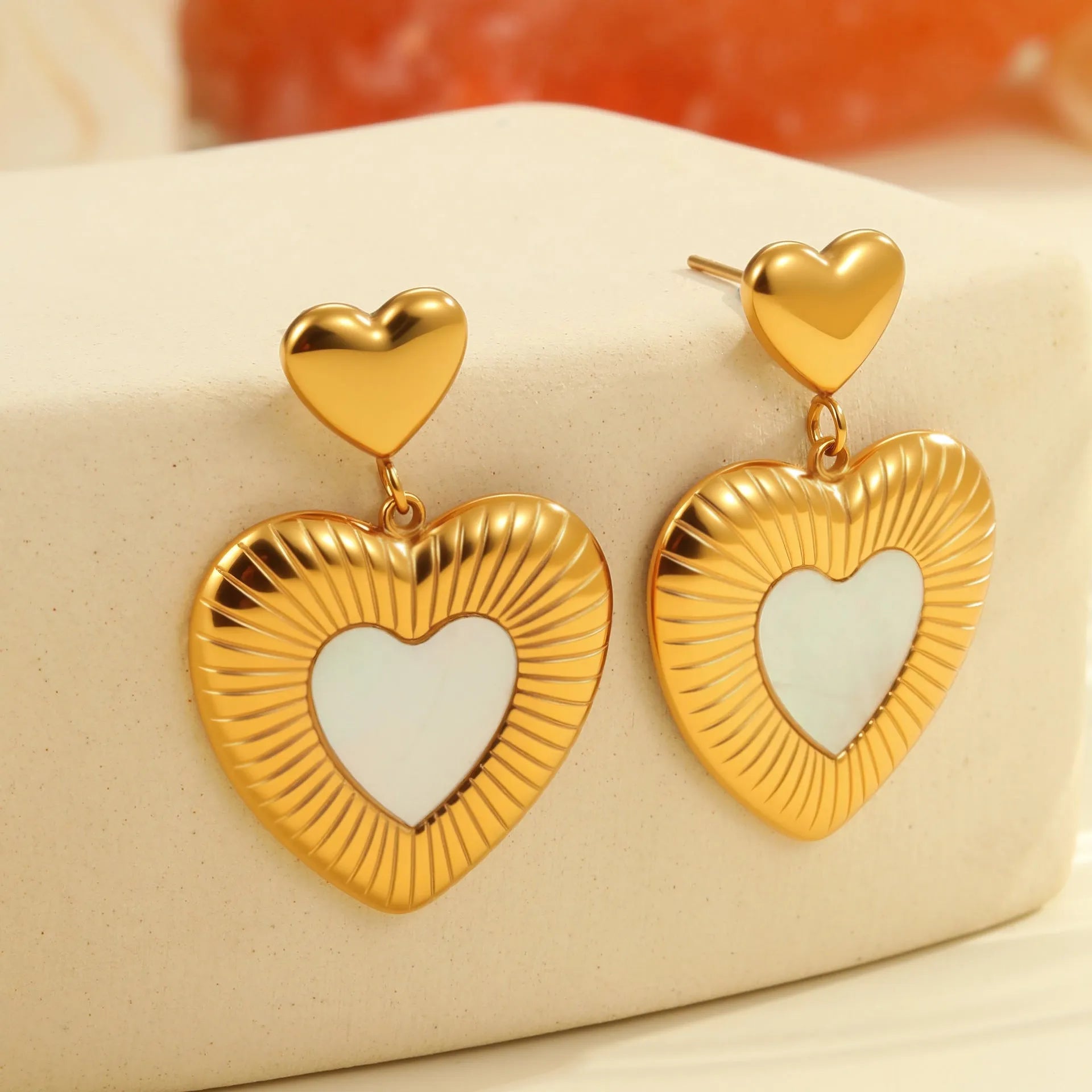 Gold-colour electroplated heart earrings with fritillary detail on stainless steel