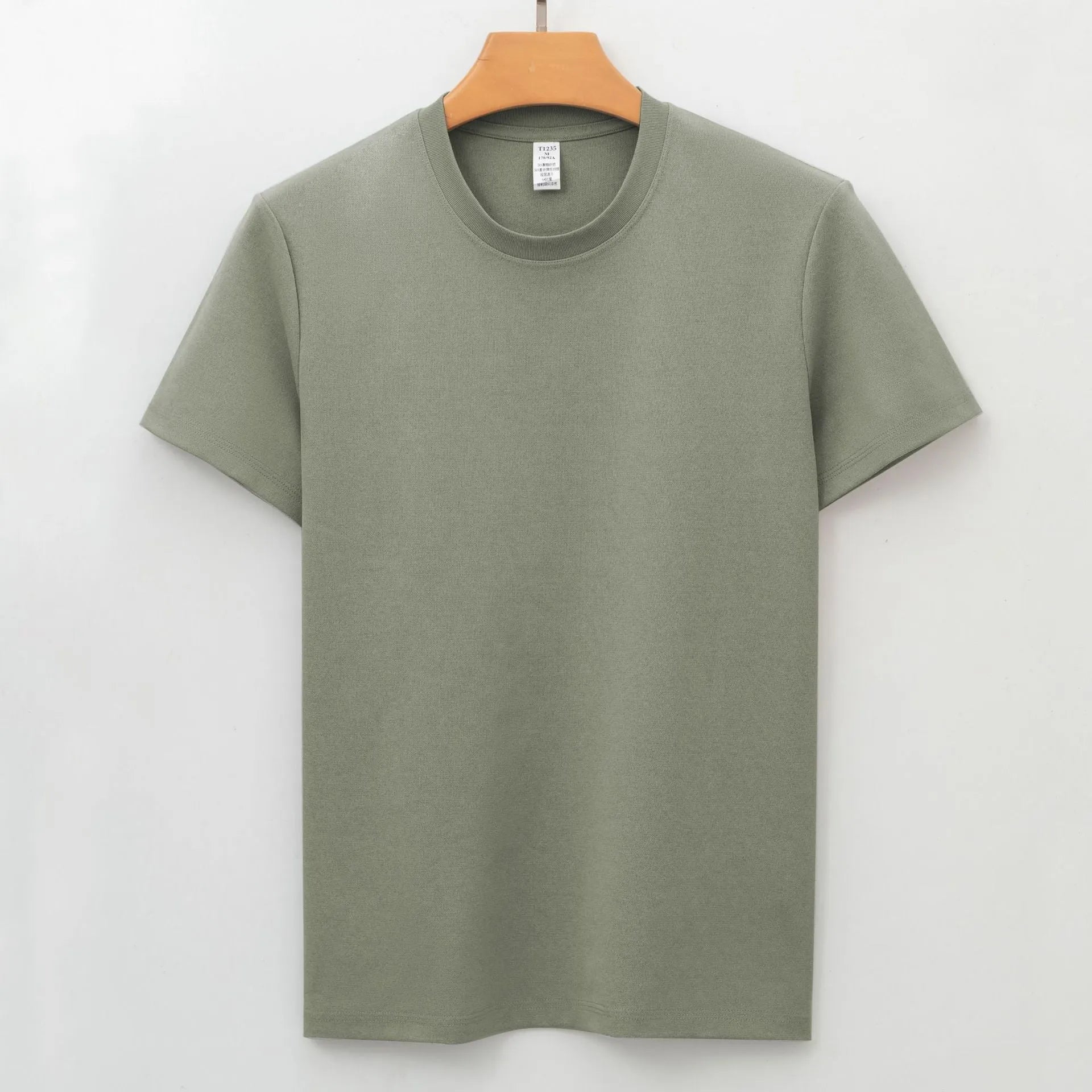 Men's solid colour antibacterial quick-dry short sleeve t-shirt on a hanger, straight cut style.