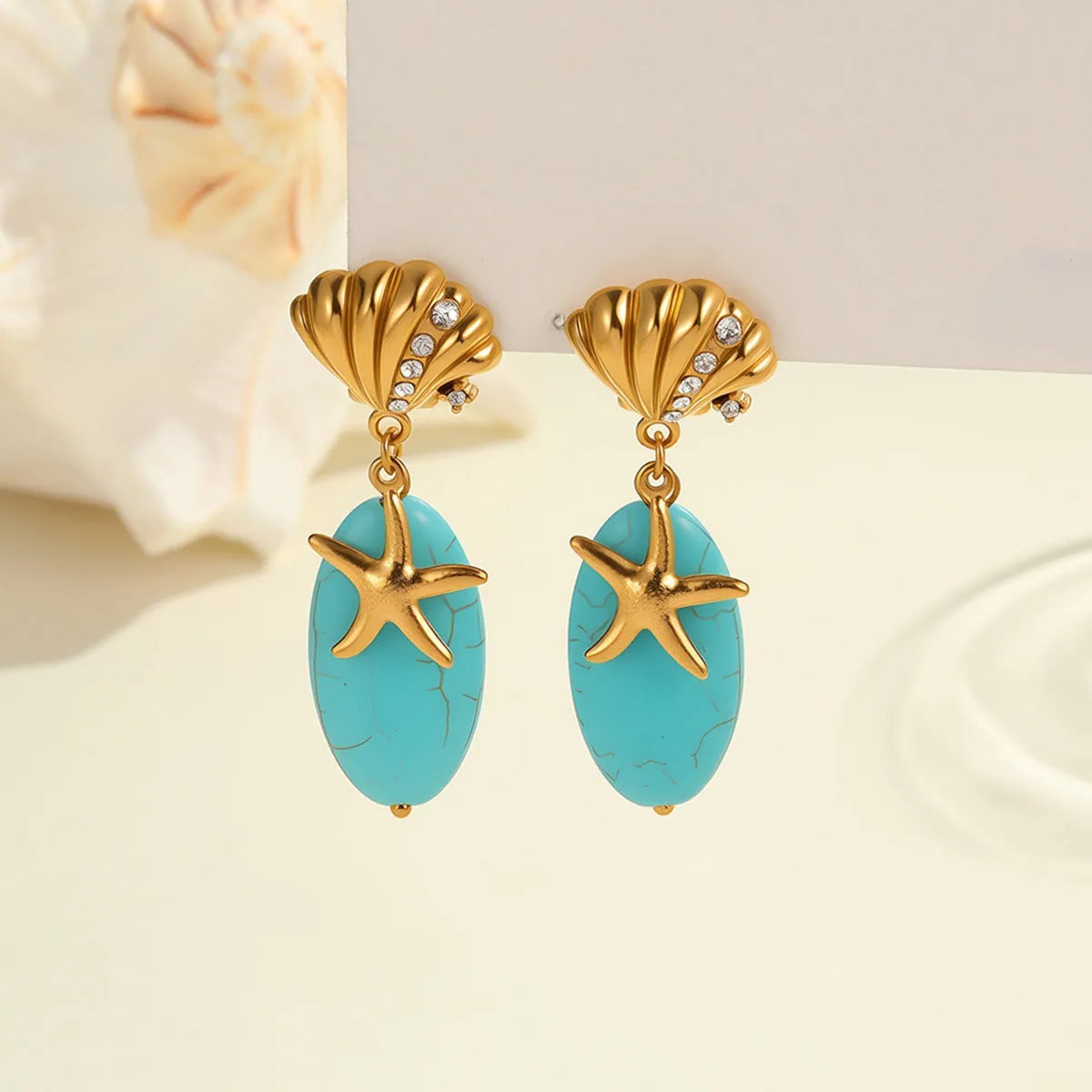 Natural turquoise stone earrings in stainless steel with 18K electroplated gold-tone geometric star shape