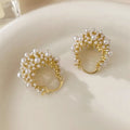Gold tone women's flower basket earrings with small rice-shaped beads and pearl inlay detail