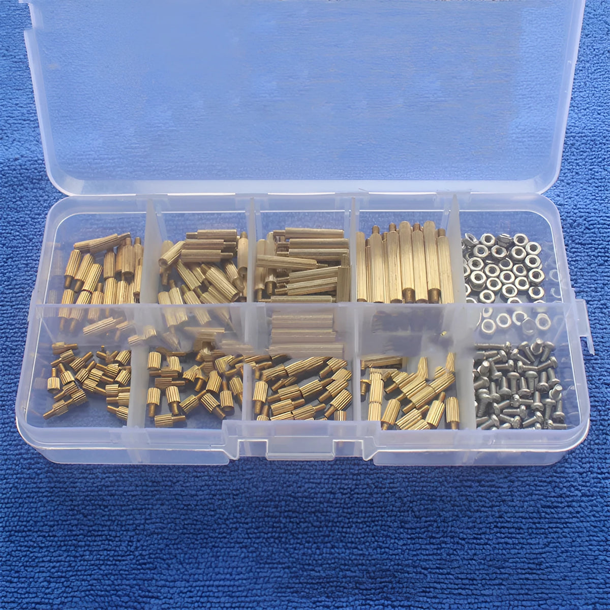 Gold-coloured 260-piece stainless steel screw nut and brass copper column set stored in a clear compartment box