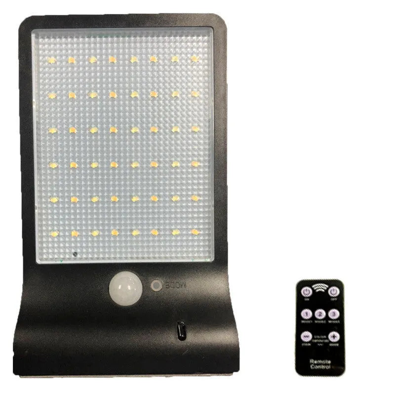 Black and white waterproof solar-powered LED garden light for outdoor use.