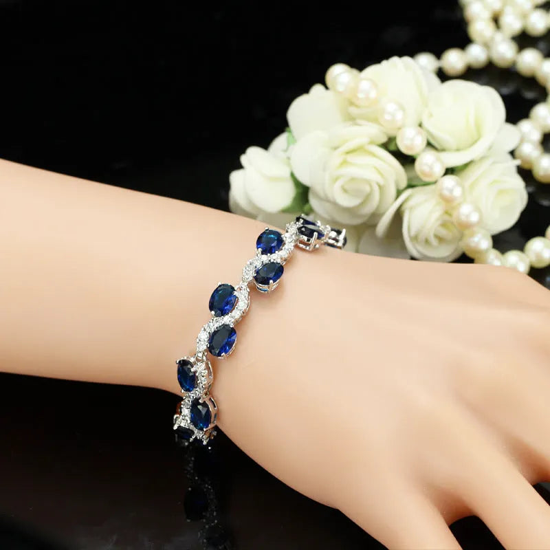 Copper-plated gold bracelet with AAA+ zircon stones in geometric design, 18.4 cm length