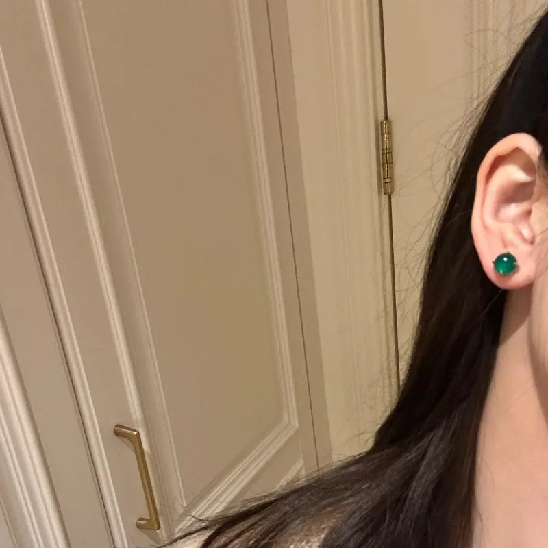 Round chalcedony stud earrings in a Chinese retro style with a four-claw copper setting.