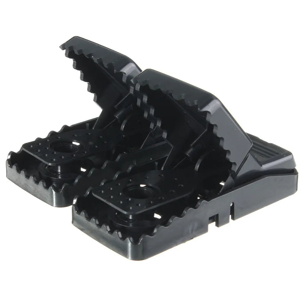 Six black plastic snapping mousetraps with metal trigger, shown on a white background.