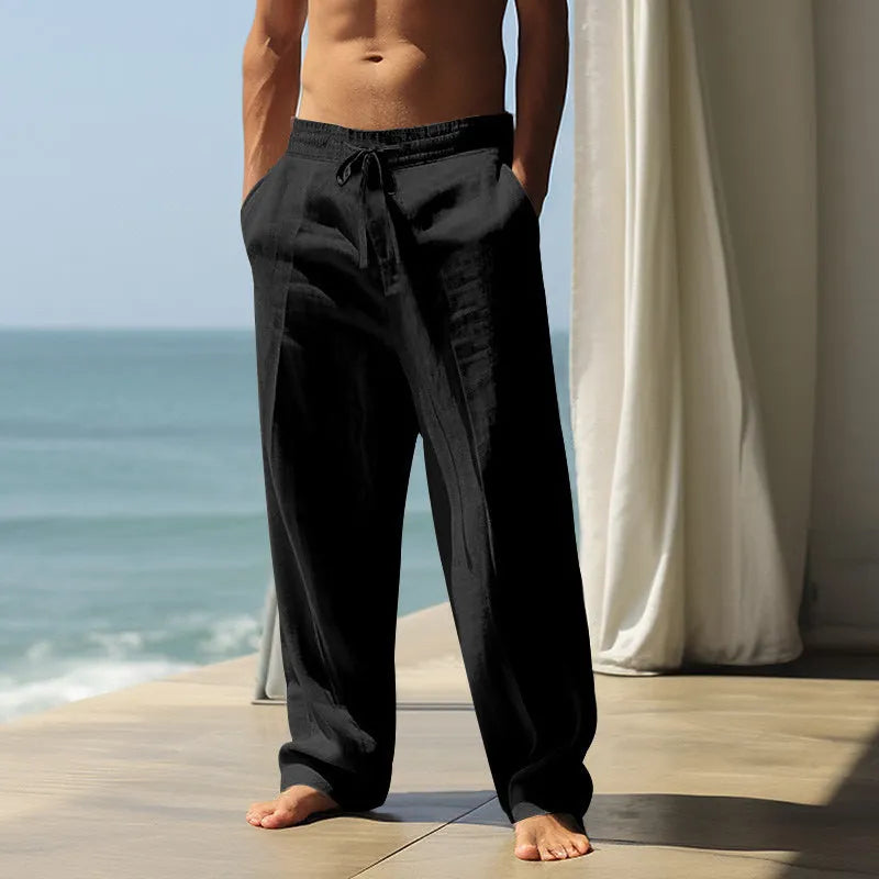 Men's loose cotton casual trousers in solid colours showing fit and fabric detail