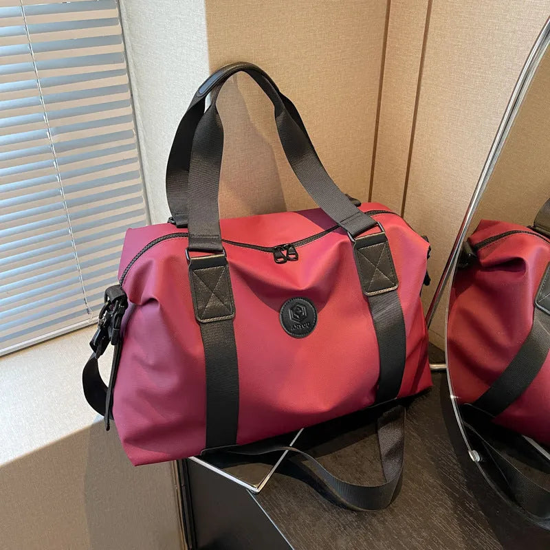 Large black waterproof Oxford cloth travel bag with dry-wet separation compartments.