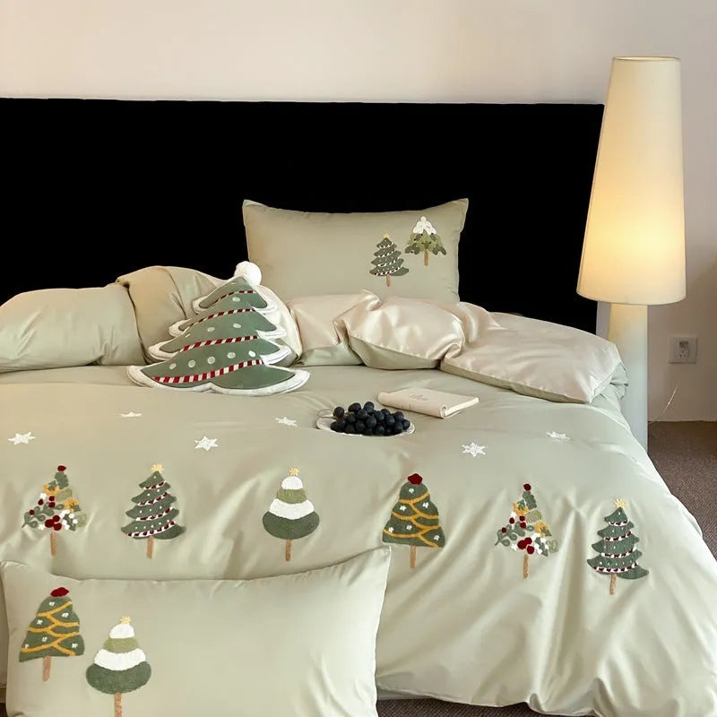 Cream blue duvet cover with embroidered Christmas tree and towel motif, part of a 100% cotton four-piece bedding set.