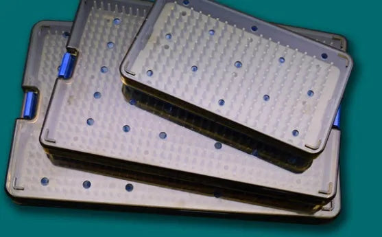 Flexible blue silicone UV disinfection box open, showing internal chamber and UV lights, with a mobile phone inside.