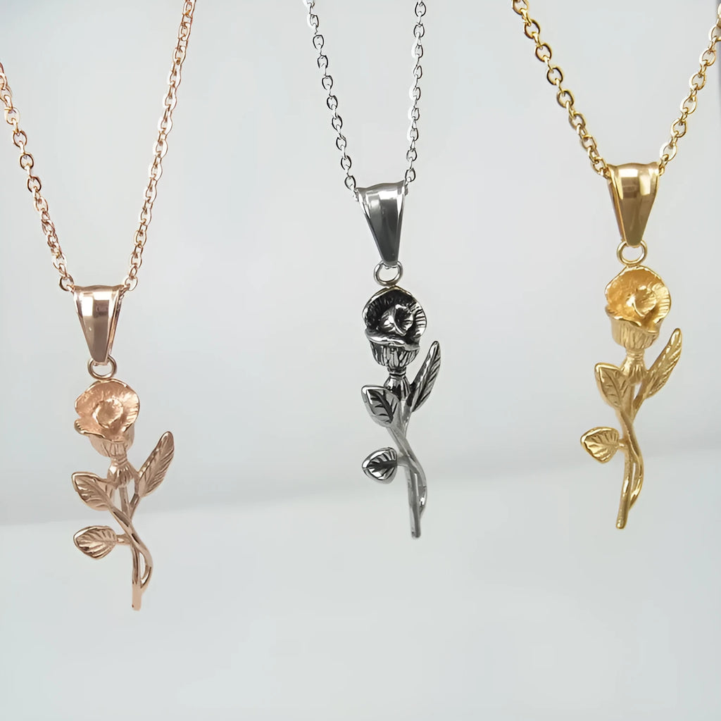 Stainless steel gold roses necklace for men with cross pendant and polished chain on display