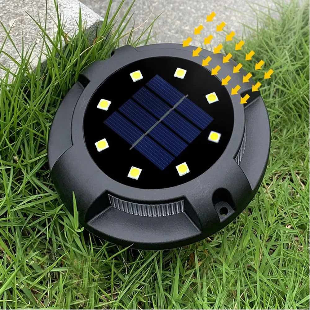 Black LED solar underground light, 11 x 4 x 13cm, for outdoor lawn and garden path use