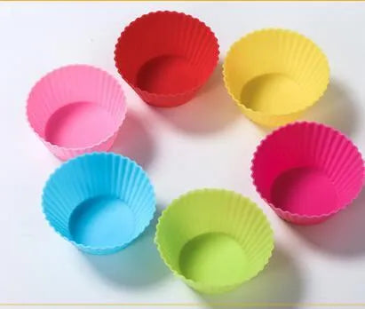 Twelve reusable silicone cupcake liners in six colours, two cups per colour, with a nonstick surface.