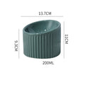 Elevated ceramic cat bowl in green colour showing raised design for feeding