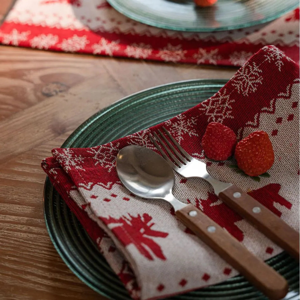Home Christmas jacquard table runner in polyester cotton with jacquard red deer flat hem design on a table setting