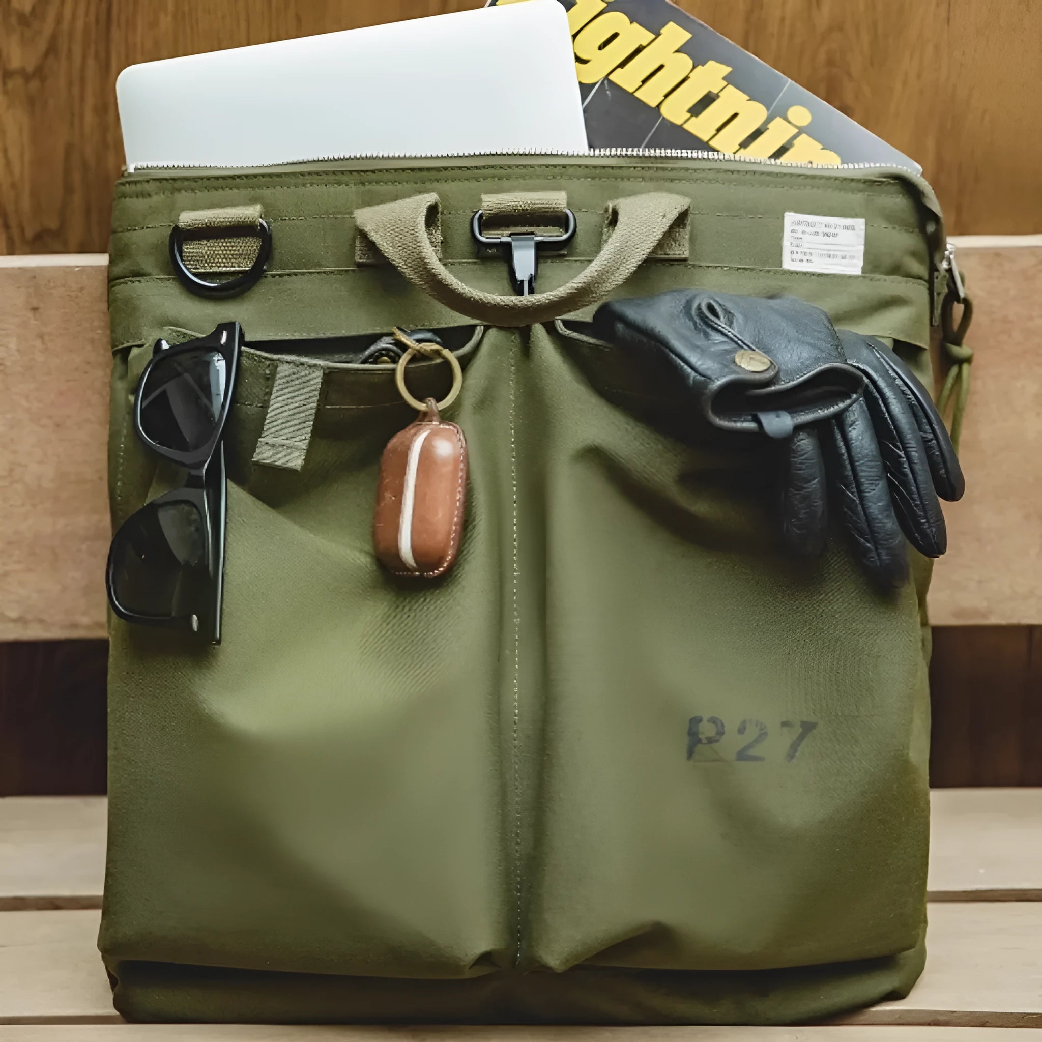 Retro military green canvas messenger bag with crossbody strap and zipper closure
