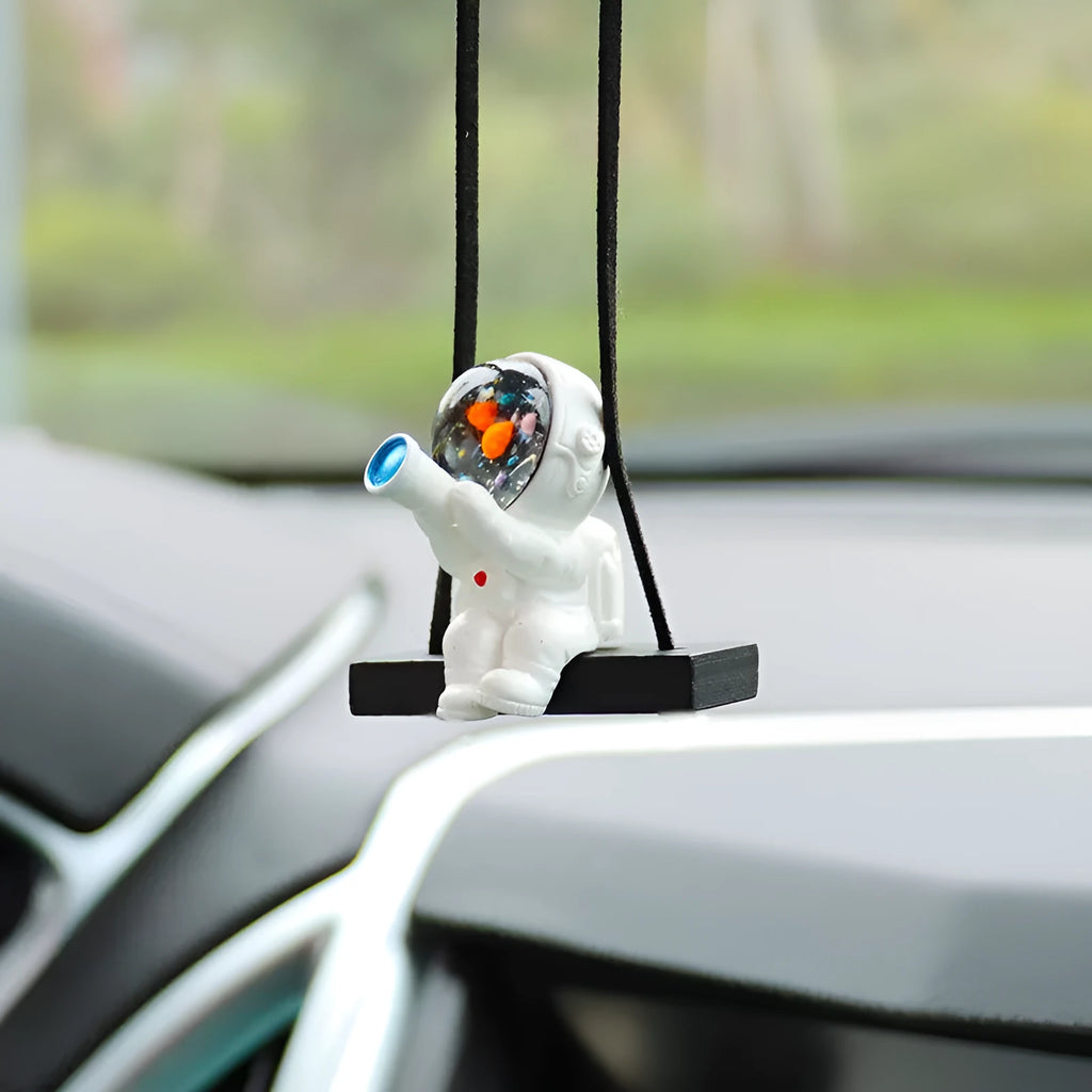 Resin cartoon astronaut car pendant in five designs: telescope, red flag, radish, headrest, and resting astronaut