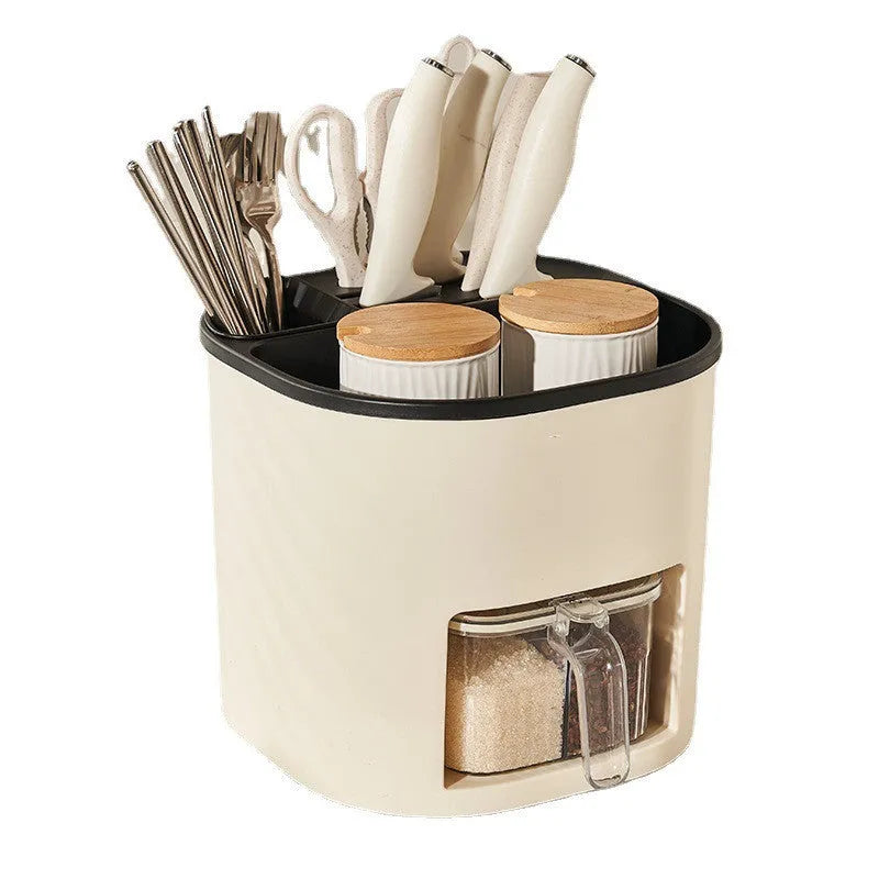 Plastic 360-degree rotating kitchen storage organiser with four compartments holding cutlery and a spice box