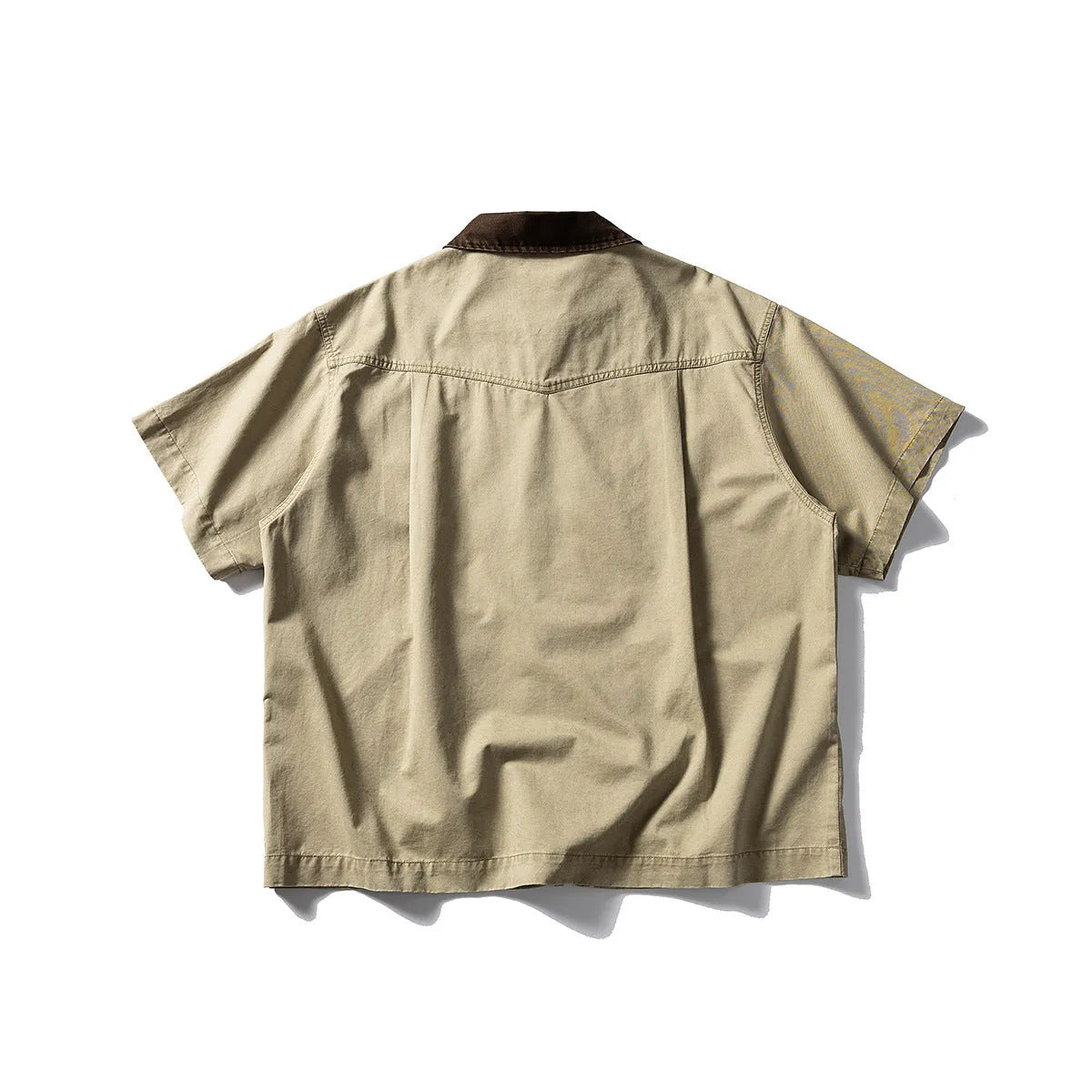 Grey loose-fit short-sleeved cardigan-style overalls shirt on a hanger.