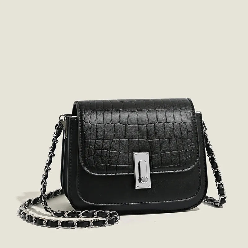 Soft PU leather women's crossbody shoulder bag in black, shown with a phone in the interior pocket.