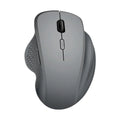 Grey wireless optical mouse for laptops with USB charging cable on white background