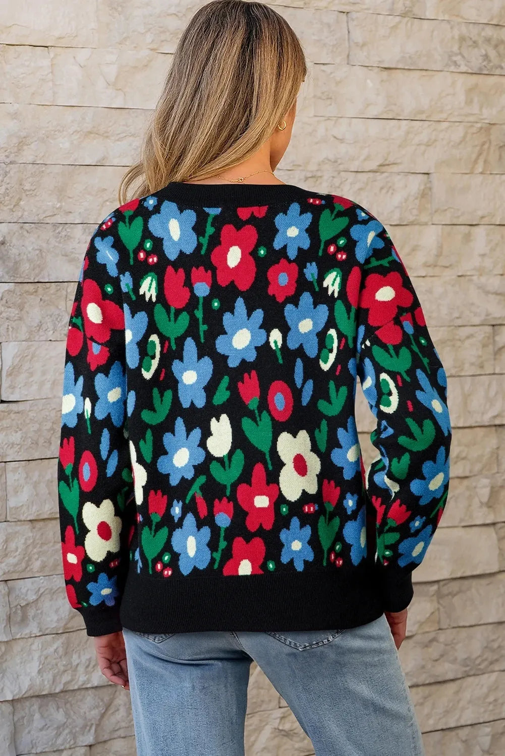 Black floral print V-neck button short cardigan sweater on model, long sleeves, shift silhouette