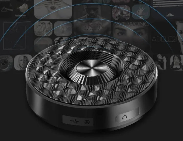 Compact black Bluetooth speaker with silicone cover showing control buttons.