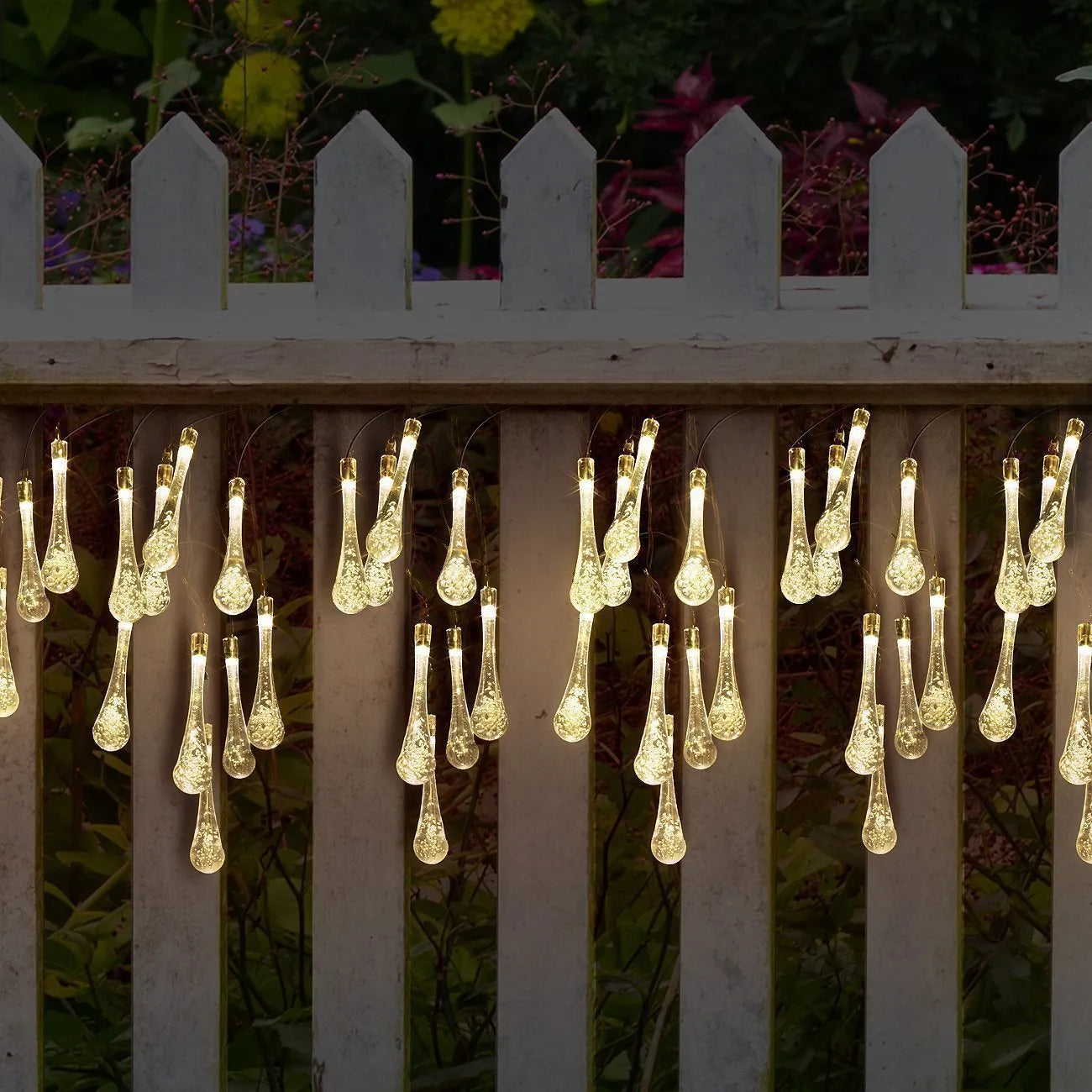 Solar-powered outdoor LED string lights with water drop pendants on 6.5 metre cable