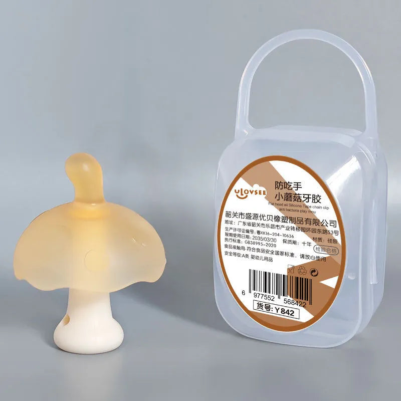 Small pink mushroom-shaped latex chewing gum in a transparent box with a chain.