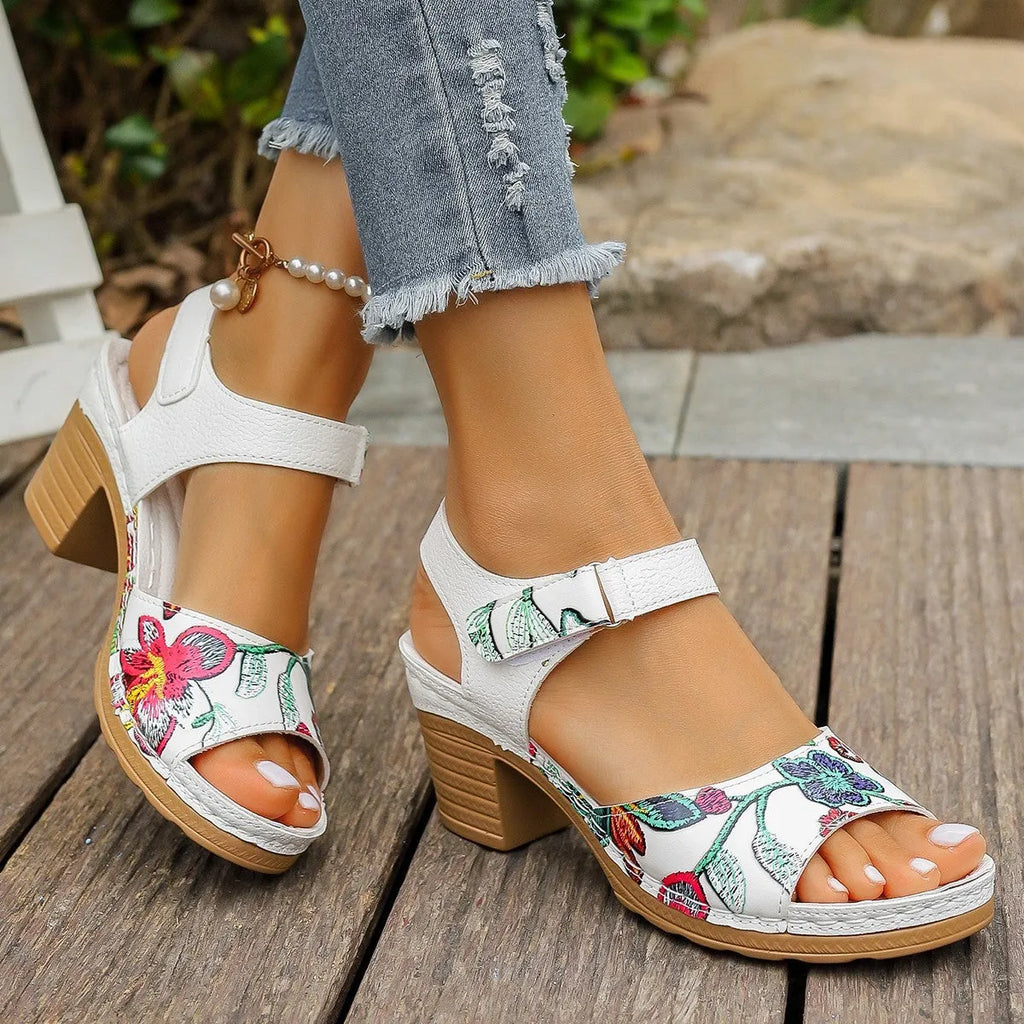 White women's high heel sandals with a Velcro buckle strap and rubber sole