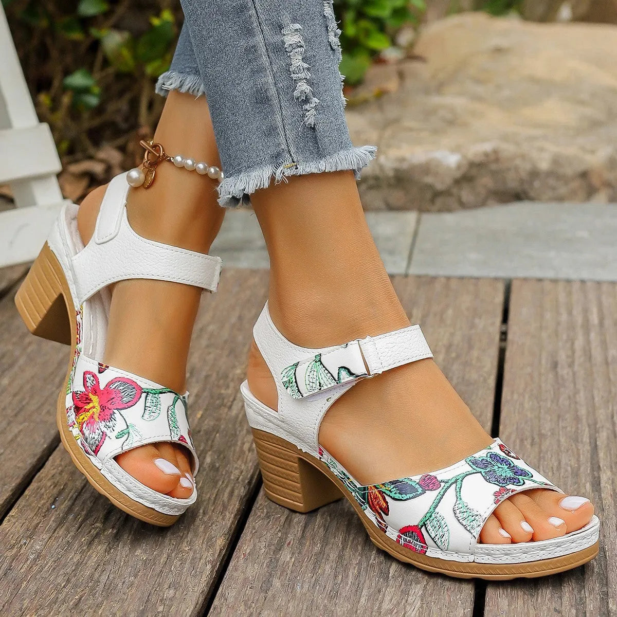 White women's high heel sandals with a Velcro buckle strap and rubber sole