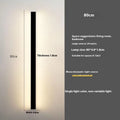 Black minimalist bedside wall lamp in 40cm to 200cm lengths with three light colour options on a wall