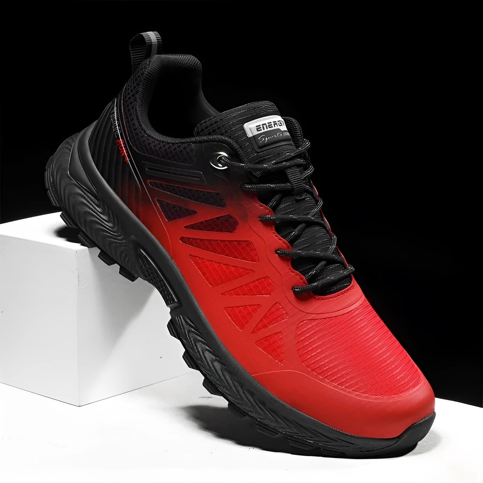 Plus size men's black and orange outdoor running shoe with mesh upper and lace-up front.